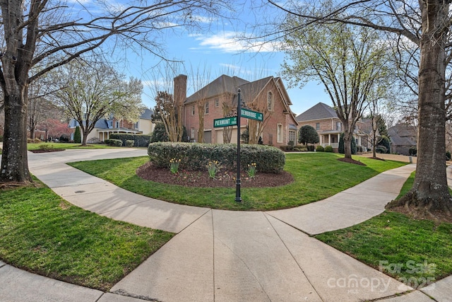 exterior space with a residential view and a front yard