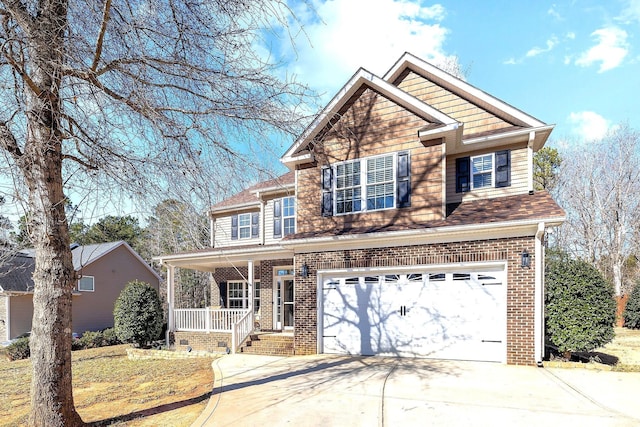 craftsman house featuring driveway, a porch, an attached garage, and brick siding