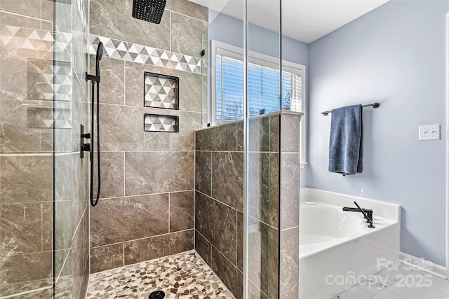 full bath featuring baseboards, tiled shower, and a bath