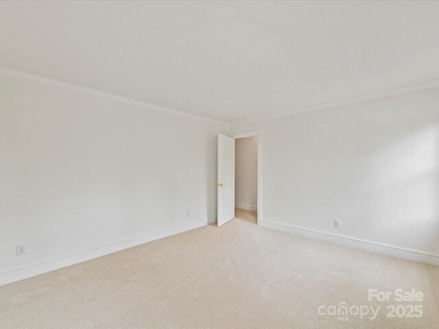 2411 Calais Pl, Charlotte, NC 28211 - empty room featuring light carpet, baseboards, and crown molding