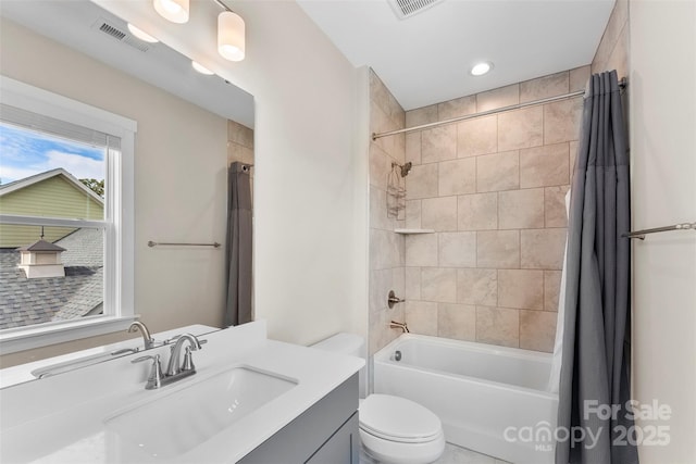 full bath featuring toilet, shower / bathtub combination with curtain, visible vents, and vanity