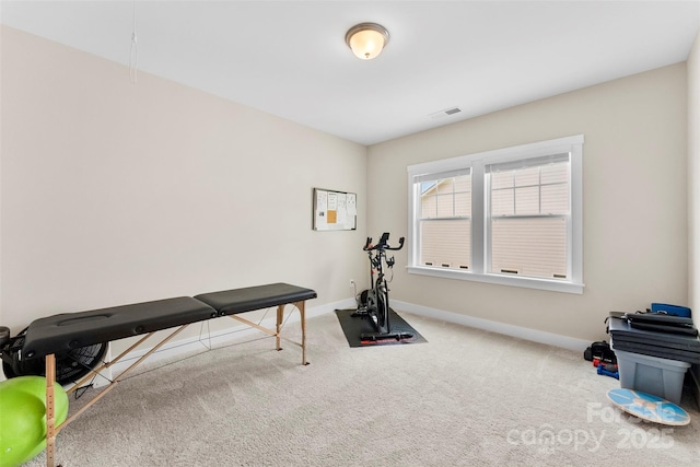 exercise area featuring carpet, visible vents, and baseboards