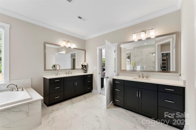 full bath featuring crown molding, a sink, and tiled shower