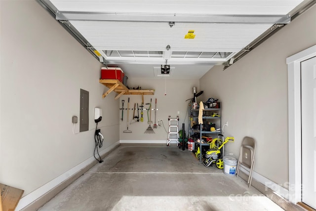 garage with baseboards, electric panel, and a garage door opener