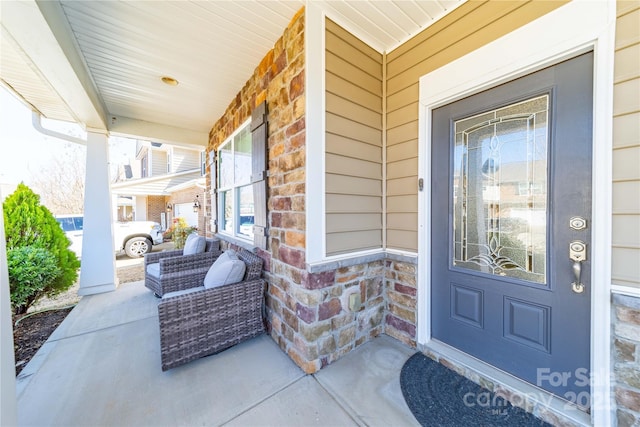 entrance to property featuring a porch