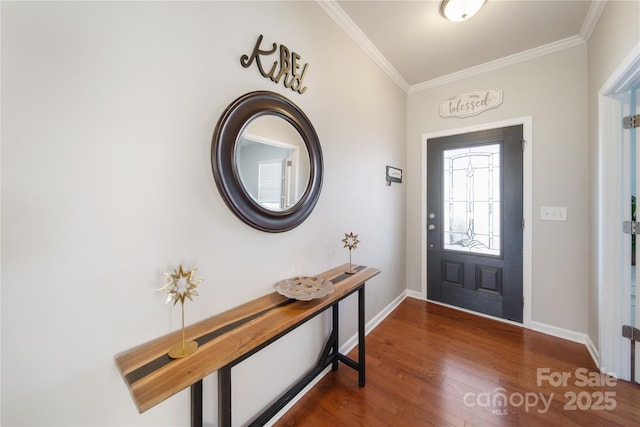 entryway with crown molding, wood finished floors, and baseboards