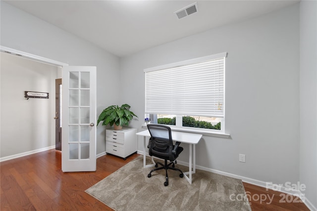 office space featuring visible vents, wood finished floors, french doors, baseboards, and vaulted ceiling