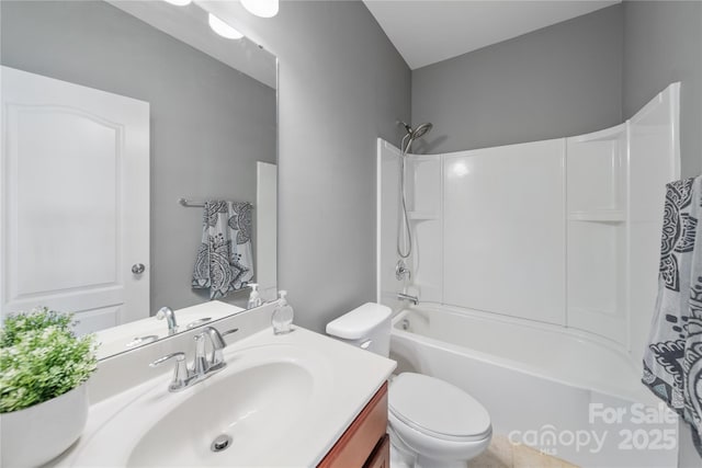 bathroom with shower / bathing tub combination, toilet, and vanity