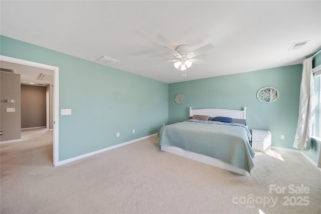 carpeted bedroom featuring baseboards and visible vents