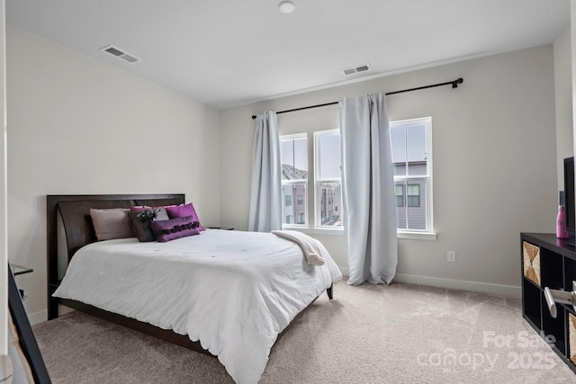 bedroom featuring carpet, visible vents, and baseboards