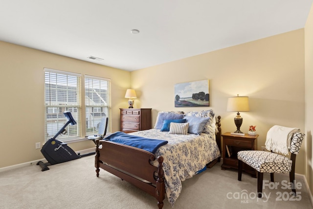 bedroom with visible vents, carpet floors, and baseboards