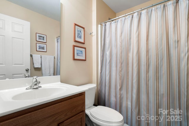 full bath featuring toilet and vanity