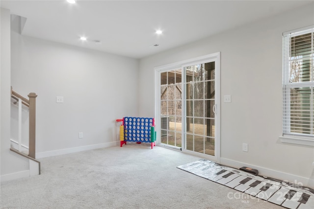 interior space with recessed lighting, baseboards, and carpet