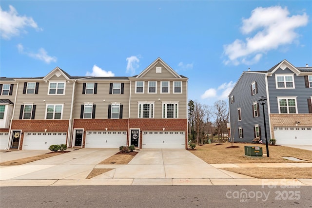 view of property featuring brick siding, central AC unit, driveway, and a garage