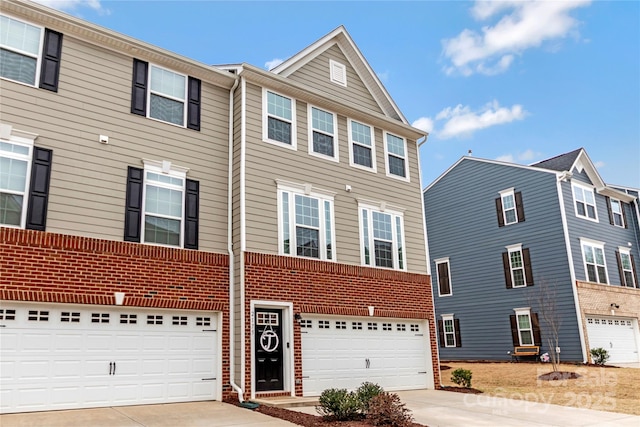 townhome / multi-family property featuring brick siding, concrete driveway, and an attached garage