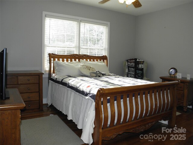 bedroom featuring a ceiling fan and wood finished floors