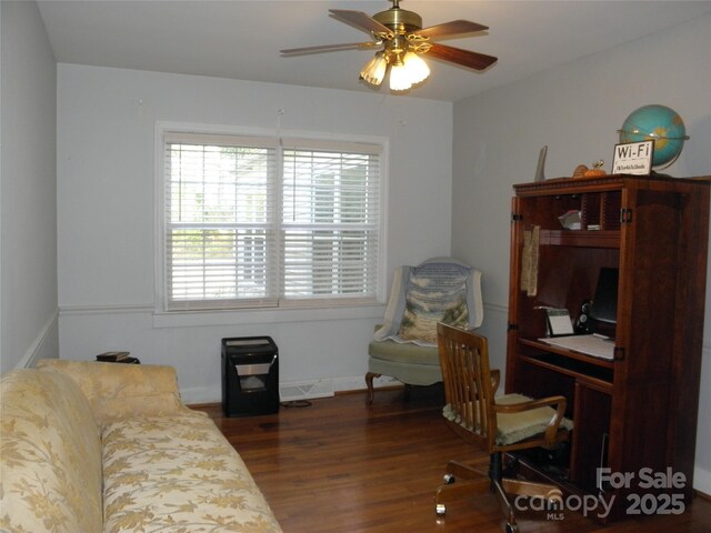 home office with a ceiling fan and wood finished floors