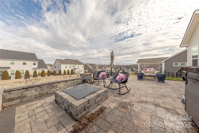 view of patio / terrace featuring a residential view, outdoor lounge area, and fence