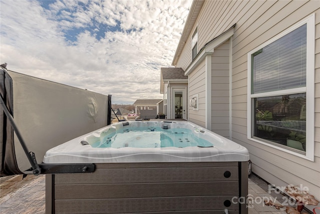 view of patio with a hot tub