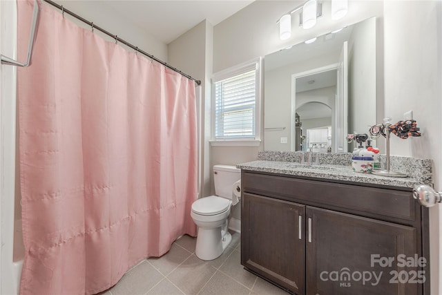 full bath featuring vanity, tile patterned floors, toilet, and a shower with curtain