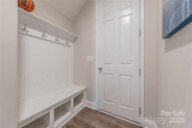 mudroom featuring wood finished floors and baseboards