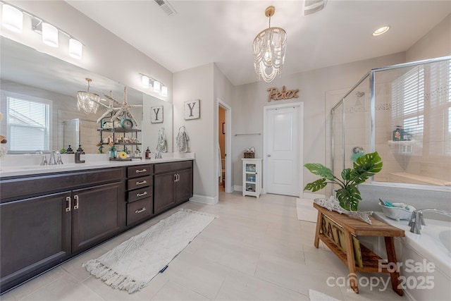 bathroom featuring visible vents, vanity, an inviting chandelier, and a shower stall