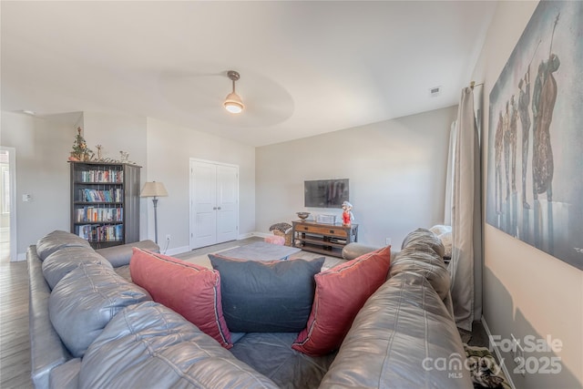 living room with visible vents and baseboards