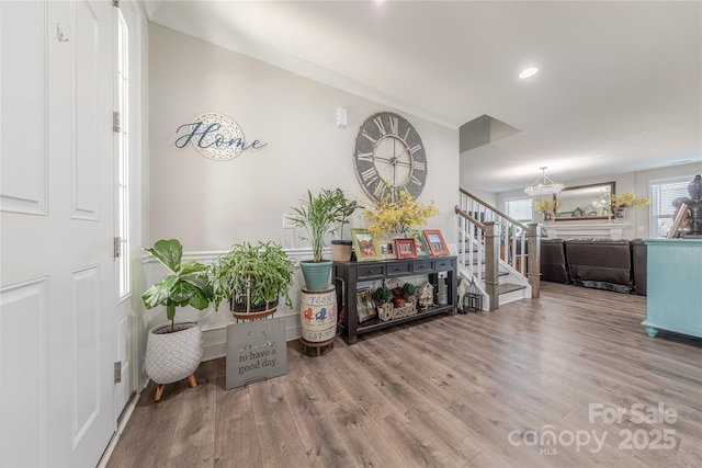 interior space with stairs, recessed lighting, and wood finished floors