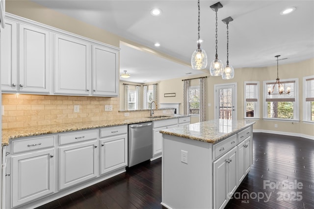 kitchen with backsplash, dark wood-type flooring, a notable chandelier, white cabinetry, and stainless steel dishwasher