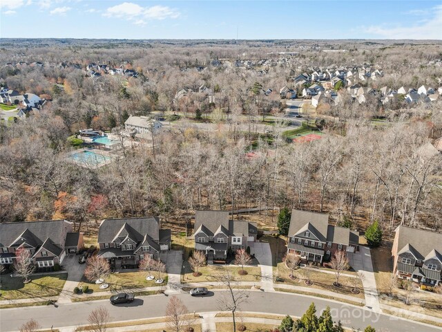 birds eye view of property with a residential view