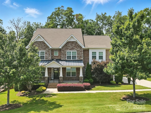 4708 Pearmain Dr, Waxhaw, NC 28173 - craftsman house featuring a front yard, a porch, and a standing seam roof