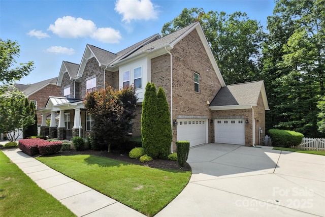 4708 Pearmain Dr, Waxhaw, NC 28173 - view of front facade with brick siding, driveway, an attached garage, and a shingled roof