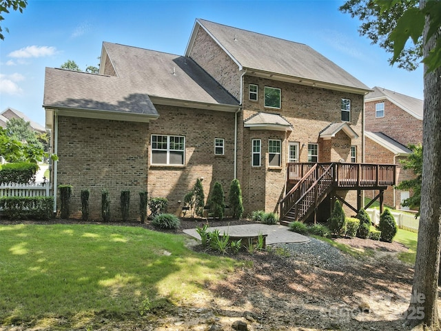 4708 Pearmain Dr, Waxhaw, NC 28173 - rear view of property featuring a deck, stairway, a patio area, brick siding, and roof with shingles