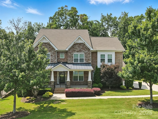 4708 Pearmain Dr, Waxhaw, NC 28173 - craftsman-style house with a front yard, covered porch, and stone siding