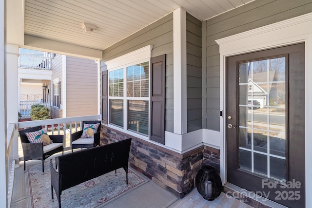 doorway to property featuring a porch