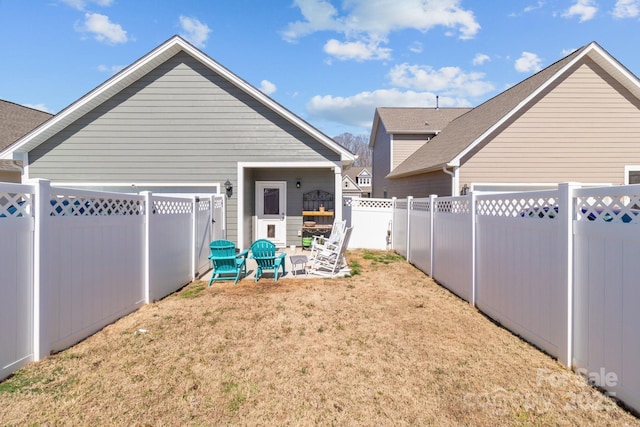 exterior space with a fenced backyard