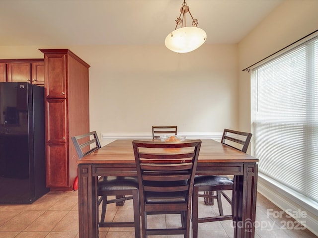 dining room featuring light tile patterned flooring