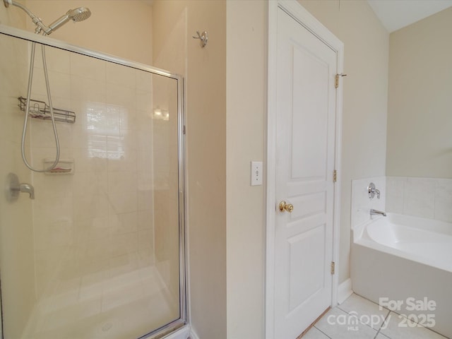 full bath with tile patterned flooring, a garden tub, and a shower stall