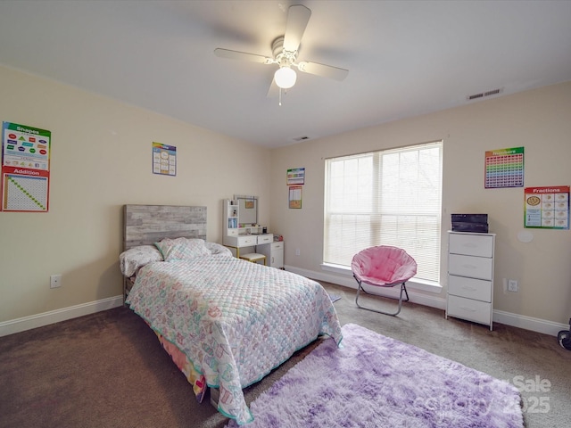 carpeted bedroom featuring baseboards, visible vents, and ceiling fan