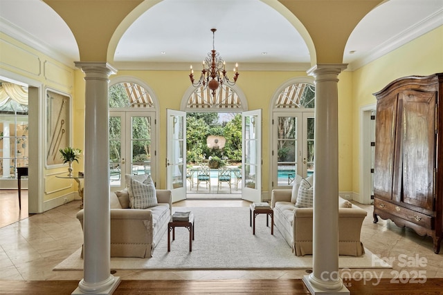 sunroom with french doors and ornate columns