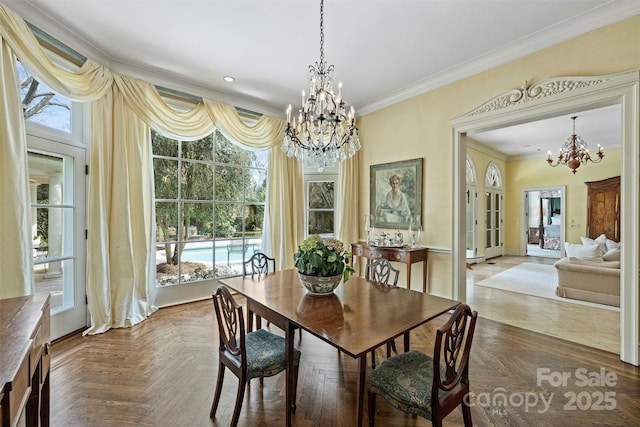 dining area featuring crown molding, recessed lighting, and a chandelier