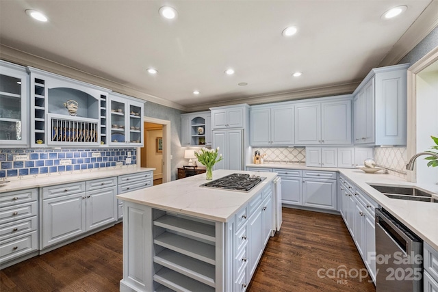 kitchen featuring open shelves, stainless steel appliances, a kitchen island, and a sink