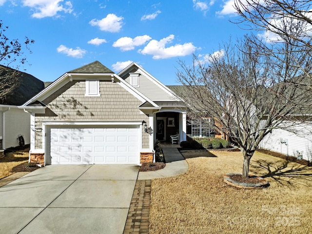 view of front facade featuring driveway and an attached garage