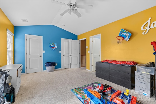 rec room with visible vents, baseboards, lofted ceiling, carpet floors, and a ceiling fan