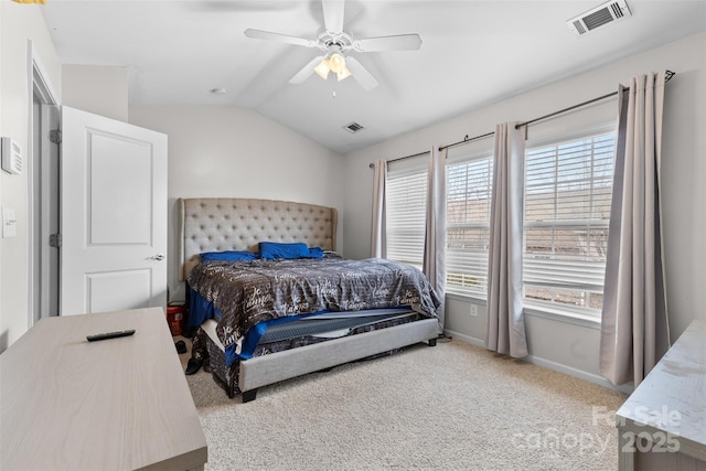 carpeted bedroom featuring baseboards, visible vents, a ceiling fan, and lofted ceiling