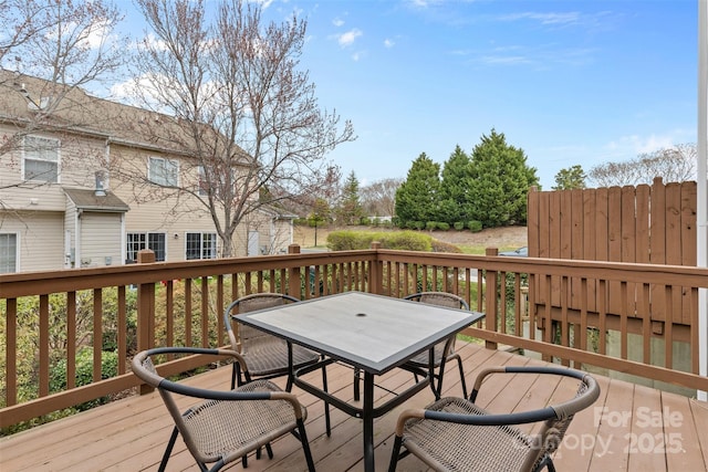 wooden deck with outdoor dining space