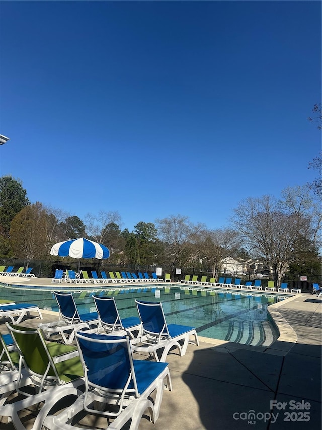 14139 Winford Ln, Charlotte, NC 28262 - community pool featuring a patio area