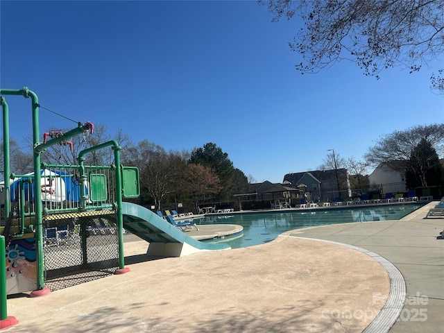 14139 Winford Ln, Charlotte, NC 28262 - community pool with playground community, fence, and a patio