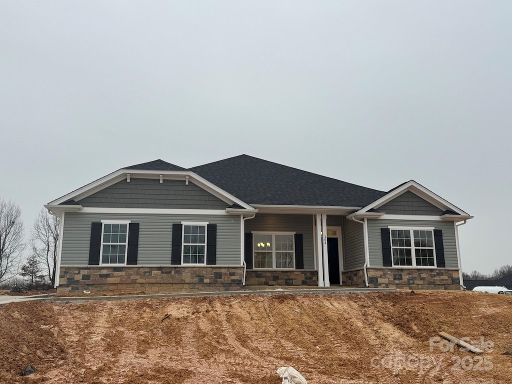 view of front of home with stone siding