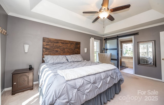 bedroom featuring a raised ceiling, a barn door, baseboards, and light carpet